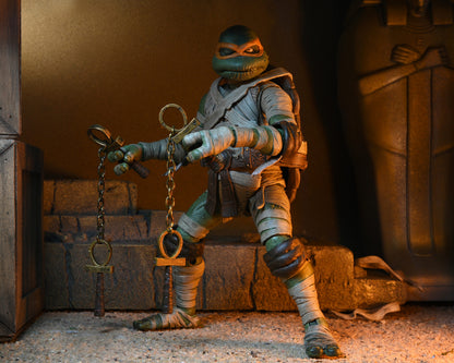 Universal Monsters x Teenage Mutant Ninja Turtles – 7” Scale Action Figure – Ultimate Michelangelo as The Mummy (NECA)