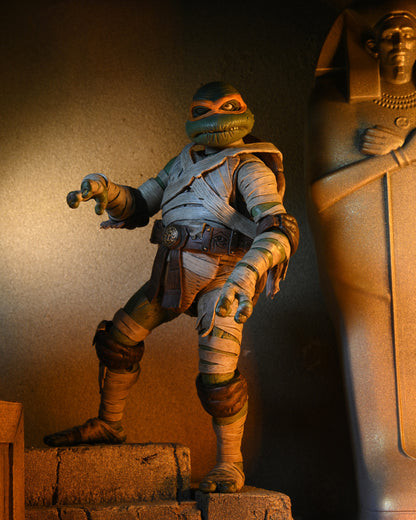 Universal Monsters x Teenage Mutant Ninja Turtles – 7” Scale Action Figure – Ultimate Michelangelo as The Mummy (NECA)