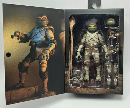 Universal Monsters x Teenage Mutant Ninja Turtles – 7” Scale Action Figure – Ultimate Michelangelo as The Mummy (NECA)